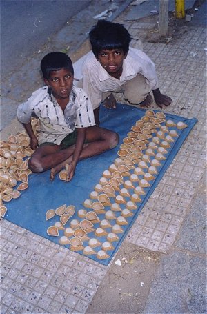 Boys Selling Diwali Diyas  