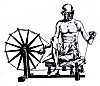 Gandhiji with his spinning wheel.